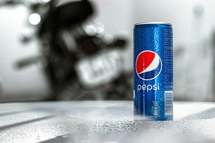 pepsi can on gray table